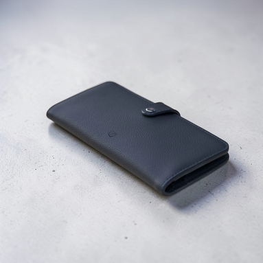 Minimalista Bag dark grey pebbled leather long wallet with snap closure and eight card slots.